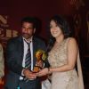 Hrishita Bhatt receives an award at Golden Achiever Awards