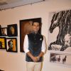 Randeep Hooda poses for the media at an Art Exhibition