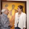 Lisa Ray interacts with a guest at Vibrant Gujrat Event
