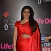 Tabu poses for the media at 21st Annual Life OK Screen Awards Red Carpet