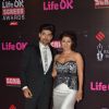 Gurmeet and Debina Choudhary pose for the media at 21st Annual Life OK Screen Awards Red Carpet