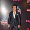 Tiger Shroff poses for the media at 21st Annual Life OK Screen Awards Red Carpet