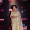 Tanuja poses for the media at 21st Annual Life OK Screen Awards Red Carpet