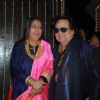 Bappi Lahiri poses with wife at their Wedding Anniversary
