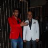 Javed Jaffrey and Naved Jaffrey pose for the media at Bappi Lahiri's Wedding Anniversary