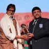 Amitabh Bachchan receives an award at Discon District Conference