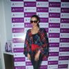Malaika Arora Khan poses for the media at About Face Salon Launch