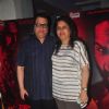 Ramesh Taurani poses with wife at the Special Screening of Badlapur