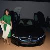 Sonakshi Sinha poses alongside the new BMW i8 at the Launch