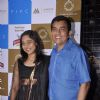 Sanjeev Kapoor poses with wife at Masala Library Launch