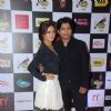 Rashmi Desai and Ankit Tiwari pose for the media at Radio Mirchi Awards