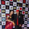 Anandan Sivamani poses with wife at Radio Mirchi Awards