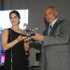 Sunny Leone receives an award at Indian Racing Excellence Awards