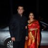 Siddharth Roy Kapoor and Vidya Balan pose for the media at Tulsi Kumar's Wedding Reception