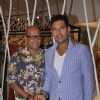 Yuvraj Singh and Narendra Kumar pose for the media at the Store Launch