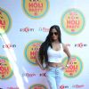 Poonam Pandey poses for the media at Zoom Holi Bash