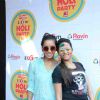 Sargun Mehta and Asha Negi pose for the media at Zoom Holi Bash