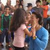 A small girl was snapped pulling Tiger Shroff's cheeks at T-Series Music Video Shoot