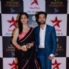 Disha Parmar and Nakuul Mehta pose for the media at Star Parivaar Awards 2015