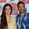 Ajay Devgn and Tabu pose for the media at the Promotions of Drishyam on Fever FM