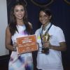 Amy Jackson gives away trophy to the student at the Promotions of Singh is Bling at Jaihind College