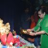 Helen Offers Prayer to Ganesh at Home
