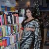 Vidya Balan poses for the media at the Launch of Piyush Jha's Book Raakshas
