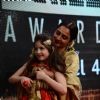Rekha was snapped holding Harshaali Malhotra at the 22nd Annual Star Screen Awards
