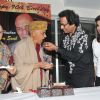 Talat Aziz feeding cake to Khayyam Saab on his 90th Birth Anniversary