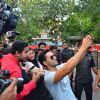 Varun Dhawan takes a selfie with fans at Promotions of Marvel's Captain America