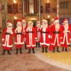 All cast dressed as SantaClaus