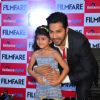 Varun Dhawan posing for click with fan at launch of Filmfare cover
