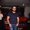 Dressed in casuals, Saif poses with his Jeep
