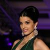 Bollywood actress Gissele Monterio showcasing H G Jewelers gold jewelry collection made with enlightened swarovski elements at a fashion show, in New Delhi on Sunday