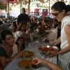 Kajol serves food to Rani Mukherjee at a Durga Pooja pandal in Mumbai
