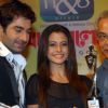 Tollywood actors Jeet and Koel with famous actors Dhritiman Chatterjee unveiling of the new Trophy of Anandalok Purashkar 2009 at a function in Kolkata on 15th oct 09