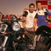 Motogp world champion Valentino Rossi and Bollywood actor John Abraham at a press meet in New Delhi on Sunday