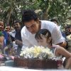 Aamir KHan blows his 45rd birthday candles with one of his child fans as he celebrated his birthday with media today at his home in Mumbai
