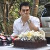 Aamir Khan gestures as he interacts with the media on his 45rd birthday at his home in Mumbai