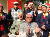 School children celebrating christmas with senior citizens at a old age home in a programme orginizied by help age India in New Delhi