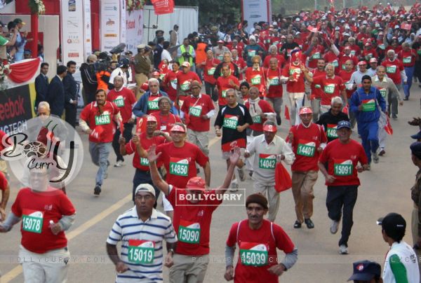 Participants during the Delhi Half Marathon, in New Delhi on Sunday