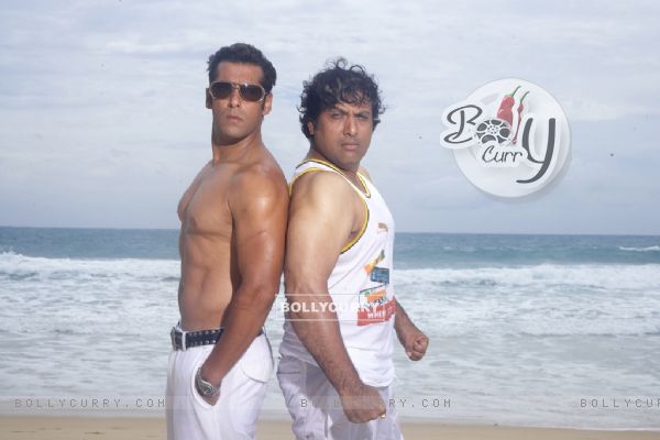 Salman and Govinda showing their body