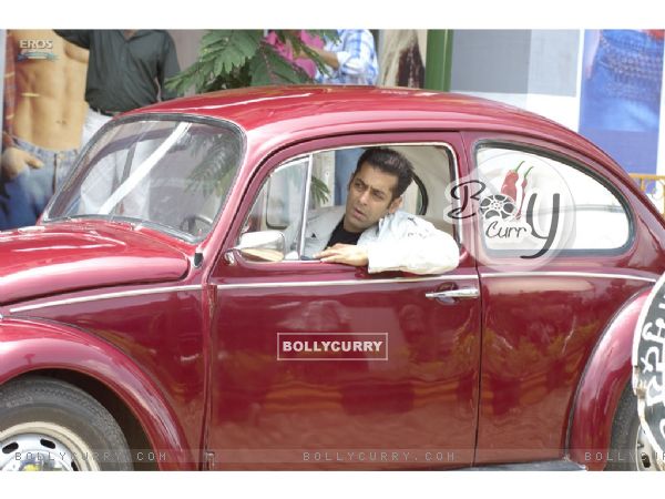 Salman Khan sitting on a car