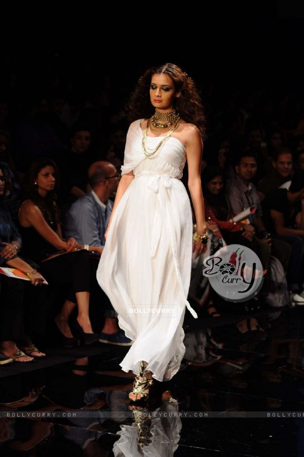 Dia Mirza displays designer Rocky S's creations during the Lakme Fashion Week day 4 in Mumbai. .
