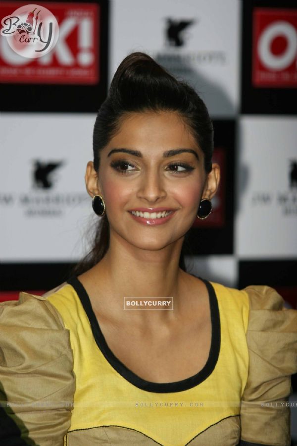 Sonam Kapoor shows off the OK magazine cover at its launch event held at Enigma in Mumbai