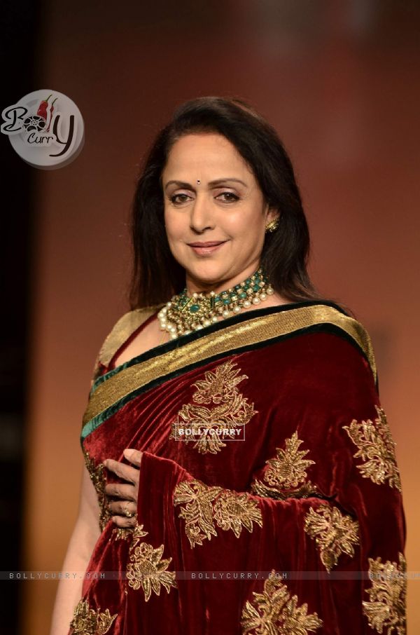 Hema Malini display creations by designers Bhumika and Shyamal during Lakme Fashion Week Day 3 in Mumbai. .