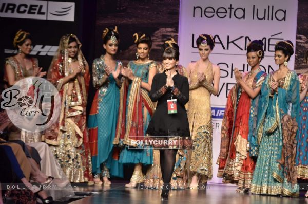 Models with designer Neeta Lulla during the Lakme Fashion Week Day 4 in Mumbai. .