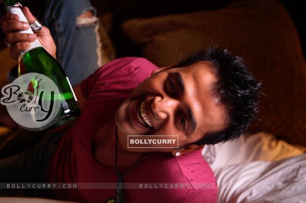 Ravi Kissen with a bear bottle
