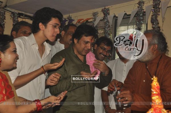 Govinda paying devote to Lord Ganesha during the occasion of Ganesh Chaturthi at their home