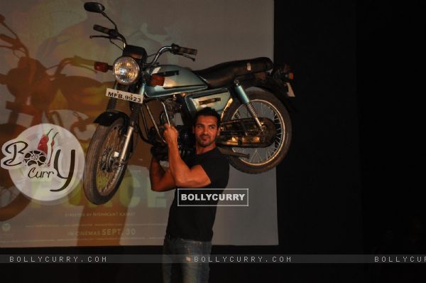 John Abraham holds up bike during the promotion of their film 'Force' in Mumbai (161276)